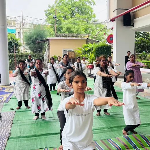 School session: warm-up stretches, June 2025