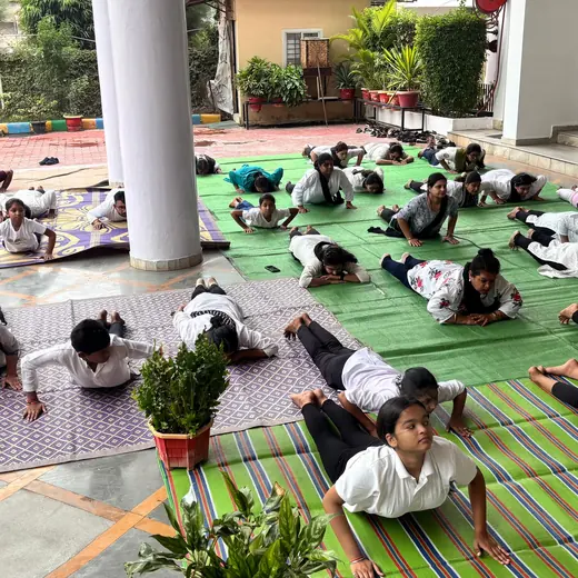 School session: students in cobra pose, June 2025