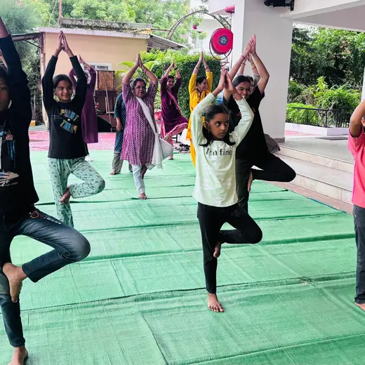 Tree pose with children, June 2025