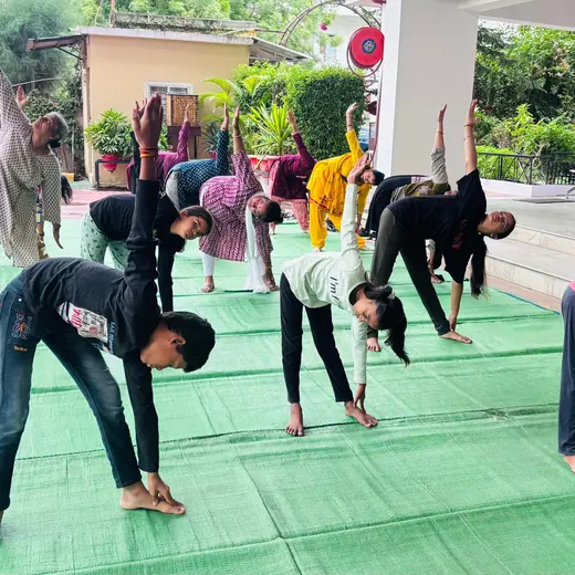 Side stretches with children, June 2025