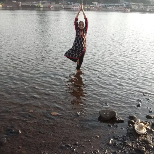 Tree pose at the water's edge, May 2026